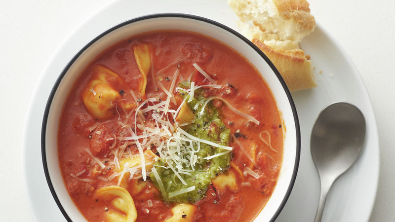 slow cooker creamy tomato and tortellini soup prepared recipe served in a bowl