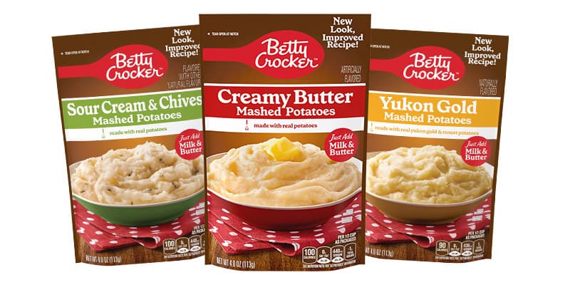 Betty Crocker Mashed potatoes in sour cream & chives, front of package; creamy butter, front of package; and yukon gold, front of package 