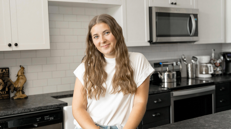 Cassidy Morris standing in the kitchen looking at the camera