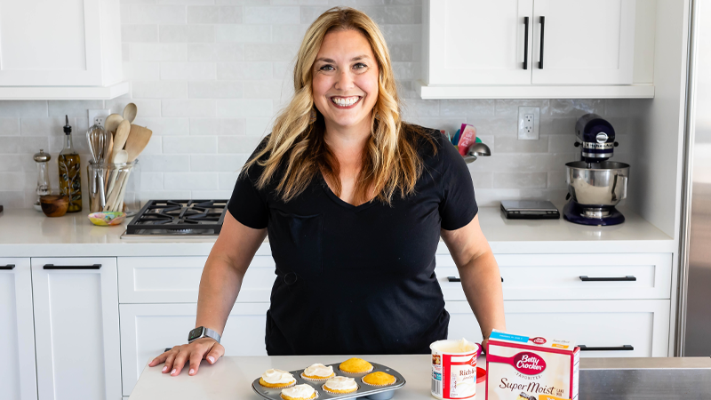 Dorothy Kern standing in the kitchen, smiling at the camera